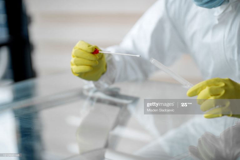Doctor taking a swab sample.