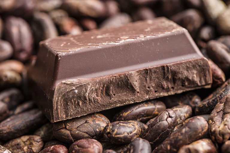The dark chocolate and cocoa beans. Chocolate bars.